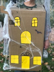 Here is the house with all the windows glued on and decorations added.